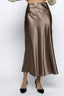 Brown satin skirt worn by a person on a white background