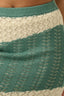 Close-up of a green and beige patterned fabric