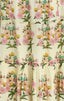 Floral patterned fabric with pink, yellow, and green flowers on a beige background