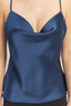 Blue satin camisole worn by a person on a plain background