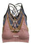 Set of four sports bras in different colors with color names displayed.