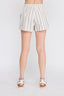 White shorts with thin gray stripes worn by a person on a white background