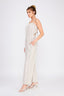 Woman wearing a white pleated dress on a white background