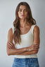 Woman wearing a white tank top 