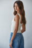 Woman wearing a white tank top 