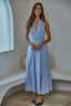 Woman wearing a light blue maxi dress.