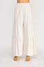 White tiered skirt worn by a person on a white background