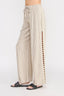 Beige striped pants with lace detailing on a white background