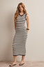 Woman wearing a navy and white striped crochet midi dress