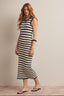 Woman wearing a navy and white striped crochet midi dress