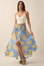 Woman wearing a blue floral skirt with yellow flowers on a beige background