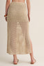 Beige woven skirt worn by a person on a plain background