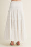 White tiered skirt on a plain background