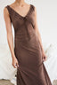 Brown dress with a tie detail on a white background
