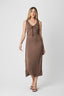 Woman wearing a brown sleeveless dress on a white background