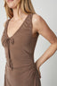 Brown sleeveless dress worn by a person on a plain background