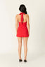 Red dress with a halter neck design on a white background