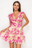 Woman wearing a pink floral dress against a white background