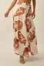 Skirt with shell pattern worn by a person on a neutral background