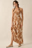 Woman wearing a floral dress with a neutral background