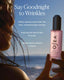 Cosmetic product with beach background and text 'Say Goodbye to Wrinkles'.