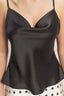 Black satin camisole worn by a person with a neutral background