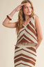 Woman wearing a brown and white striped crochet top and skirt on a beige background