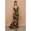 Woman wearing a floral dress against a beige background