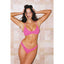 Woman wearing a pink bikini against a tiled wall.