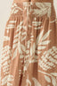 Brown floral patterned skirt with a white background