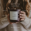 Person holding a 'Fall Leaves' candle with product details overlay