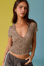 Woman wearing a leopard print top with a gradient background