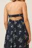 Navy floral dress with cut-out back on a neutral background