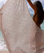 Person holding a patterned beige towel on a beach with ocean view