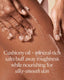 Person scrubbing their skin with a cushiony oil and mineral-rich salt product, with text describing its benefits.