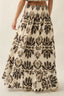 Long floral skirt with black pattern on a neutral background