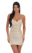 Woman wearing a beige strapless dress on a white background