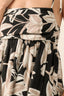 Floral patterned skirt with black, beige, and white colors on a neutral background