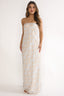 Woman wearing a strapless dress with a geometric pattern on a white background
