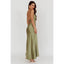 Woman wearing a green dress with a white background