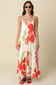 Woman wearing a floral dress with red flowers on a beige background