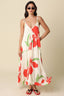 Woman wearing a floral dress with a plain background