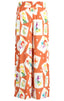 Orange pants with colorful graphic pattern on a white background