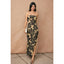 Woman wearing a strapless floral dress with a beige background