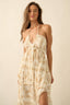 Woman wearing a beige and brown patterned dress against a beige background