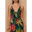 Woman wearing a floral dress with a beige background