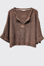 Brown knitted sweater with a hood on a white background