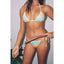Woman in a blue and yellow bikini holding a hose against a gray background