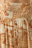 Close-up of a patterned skirt with brown and beige design