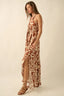 Woman wearing a patterned dress on a beige background